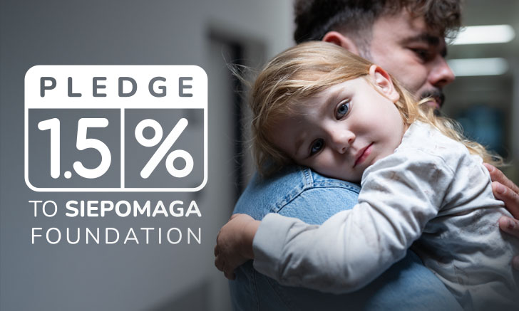 Father holding a baby in his arms. Pledge 1.5% of tax to the Siepomaga Foundation